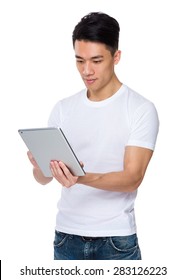 Asian Young Man Use Of Tablet