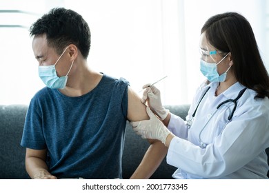 Asian Young Man Very Scare A Vaccination Shot, Man Having A Needle Phobia Problem And Feared While Shooting A Vaccine.