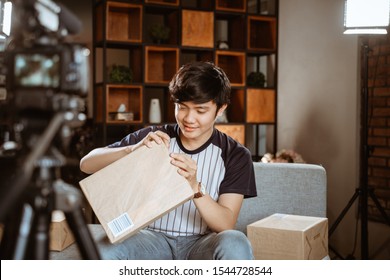 Asian Young Man Vlogger Recording New Vlog About Unboxing Review When Work At Home