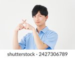 Asian young man x sign gesture by hand in white background