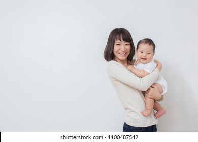 Asian Young Mom With Baby