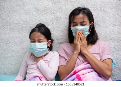 Asian Young Mother And Children Daughter Wearing Protective Mask, Maybe Coughing Until Sore Throat, Difficulty Swallow, Cold, Flu Or Fever Go To The Hospital Meet A Doctor