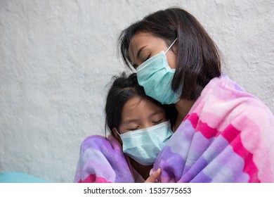 Asian Young Mother And Children Daughter Wearing Protective Mask, Maybe Coughing Until Sore Throat, Difficulty Swallow, Cold, Flu Or Fever Go To The Hospital Meet A Doctor