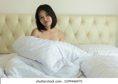 Asian teen sleeping naked