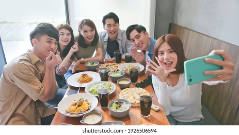 Asian Young Six Friends Taking Selfie In Restaurant Happily