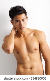 asian young sport man with perfect fitness body