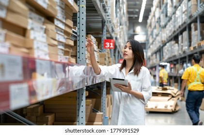 Asian young woman doing checking stock of products in warehouse by using a tablet checking inventory levels , Logistics concept. - Powered by Shutterstock