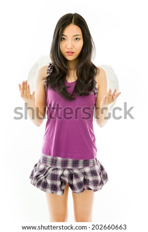 Asian young woman dressed up as an angel gesturing isolated on white background