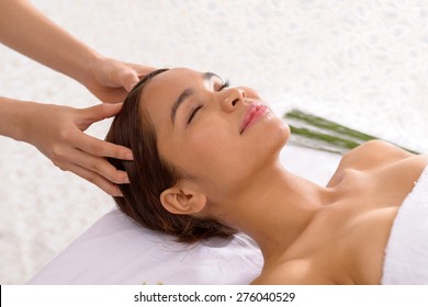 Asian Young Woman Enjoying Scalp Massage