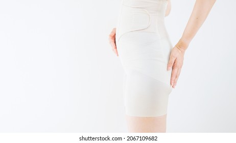 Asian Young Woman In Girdle