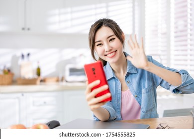 Asian Young Woman Has Video Chat With Friend By Mobile Phone Happily