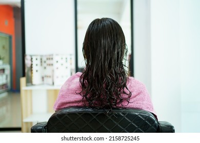 Asian Young Woman Have A Hair Cutting And Spa By Professional Beauty Hair Dresser. Woman Sitting On The Chair In Beauty - Salon Shop While Barber Cutting Her Hair.