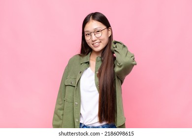 Asian Young Woman Laughing Cheerfully And Confidently With A Casual, Happy, Friendly Smile