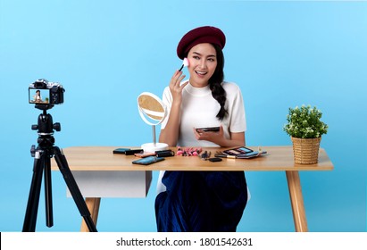 Asian young woman live streaming for beauty vlogger or blogger recording make up tutorial presenting for social people.Her is influencer in social online. - Powered by Shutterstock