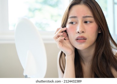 Asian Young Woman Looking Face Skin In The Mirror Have A Red Rash On Her Face From Cosmetic Allergy