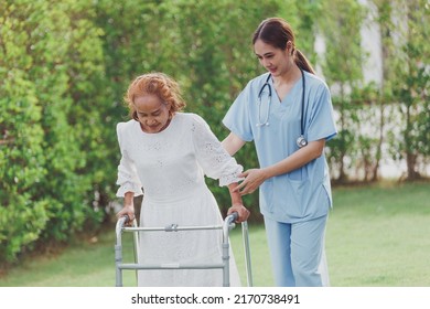 Asian young woman nurse at nursing home take care, patient and woman nurse  walk in the park, man caregiver helping patient, Happiness Asian family concepts - Shutterstock ID 2170738491