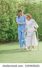 Asian young woman nurse at nursing home take care, patient and woman nurse  walk in the park, man caregiver helping patient, Happiness Asian family concepts - Shutterstock ID 2194435631