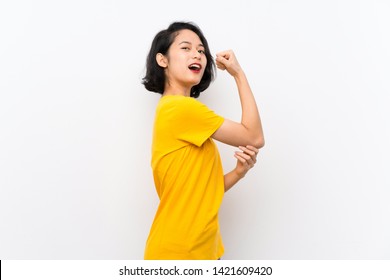 Asian Young Woman Over Isolated White Background Doing Strong Gesture