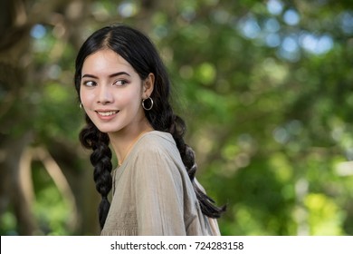 Asian young woman portrait, looking back to copy space.
