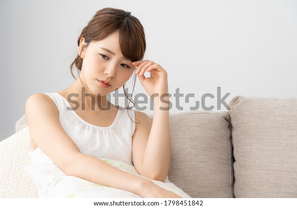 Asian young woman in the\
room