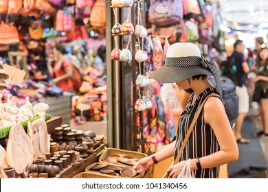 Asian Young Woman Traveling And Shopping At Chatuchak Weekend Market, Bangkok, Thailand