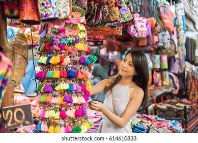 Asian Young Woman Traveling And Shopping At Chatuchak Weekend Market, Bangkok, Thailand