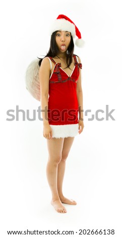 Asian young woman wearing Santa costume dressed up as an angel sticking out her tongue isolated on white background