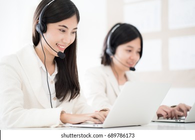 Asian Young Woman Working In Call Centre