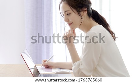 Asian young woman working from home