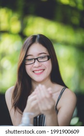 An Asian Young Women Using Alcohol Gel Washing Her Hands To Prevent Corona Virus Covid-19, Hand Sanitizer, Parademic Concept, Selfcare, Disease, Infection, Protection, Covid-19 Safety Guideline.