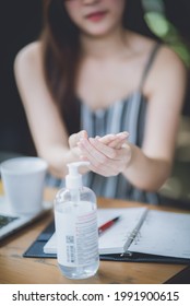 An Asian Young Women Using Alcohol Gel Washing Her Hands To Prevent Corona Virus Covid-19, Hand Sanitizer, Parademic Concept, Selfcare, Disease, Infection, Protection, Covid-19 Safety Guideline.