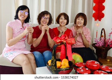 Asian4 Sisters Family Celebrate Chinese New Year.Chinese Characters In The Photo Means 