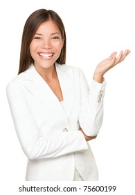 Asiane Businesswoman Gesturing Open Hand Presenting On The Side Wearing White Suit Isolated. Business Woman In White Suit Smiling  Camera Explaining Showing Something.