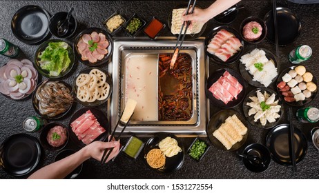 Asians Holding Steamboat Food Featuring Modern Chinese Steamboat With Meat And Vegetables