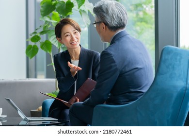 Asians in suits to talk to - Powered by Shutterstock