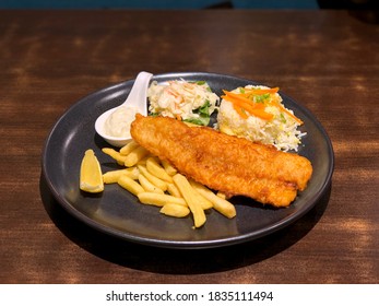 Asian-style Fish And Chips, With Fried Rice And Coleslaw