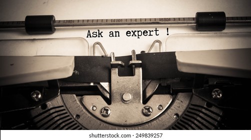 Ask an expert concept on typewriter 