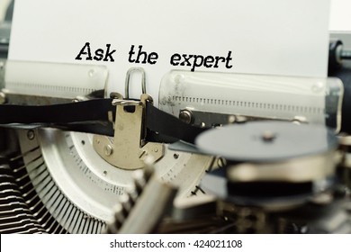 Ask The Expert - Paper Sheets In Old Vintage Typewriter . Business Concept On Toned, Grain Effect, Shallow Depth Of Field And Blurred Background