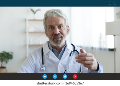 Ask General Practitioner Online, Video Call Consultation, Patient And Doctor Talk Concept. Head Shot Of Mature Male Therapist Share Information Provide Support, Laptop Screen View, Videoconference App