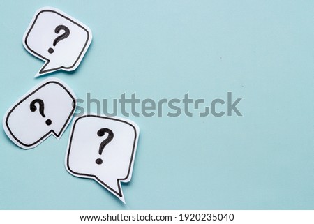 Ask question concept. Question mark on speech bubbles, top view