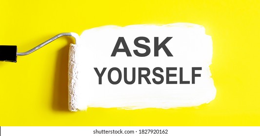 Ask Yourself .One open can of paint with white brush on it on yellow background.