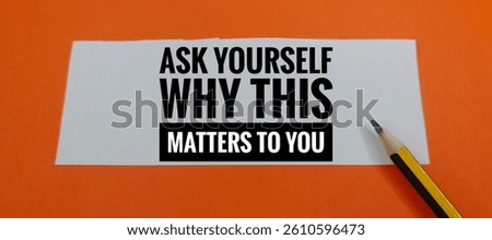 Ask Yourself Why This Matters – Thought-Provoking Question Written on Paper with Pencil on Orange Background, Concept of Self-Reflection, Purpose, and Personal Growth. 