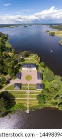 Askersund / Sweden - July 06 2019: Aerial View Of Stjernsund Castle Outside Of Askersund, Närke, Sweden In Summer, With A Person Standing On The Bridge Looking Up At The Castle.