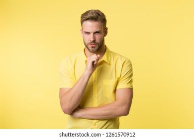 Asking Himself. Handsome Young Man Keeping Hand On Chin While Stand Yellow Background. Existentialism Concept. Hard Question. Moral Question Difficulties. Listen To Yourself. Question Without Answer.