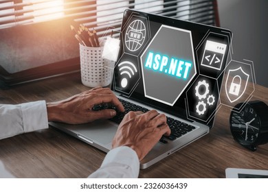 ASP.NET Development programming language concept, Person using laptop computer with ASP.NET icon on virtual screen.