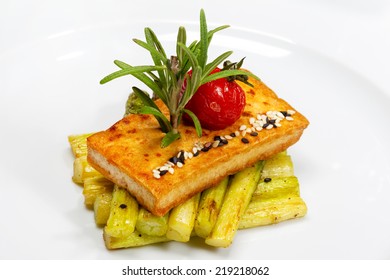 Asparagus With Croutons, Pickled Tomatoes And Sesame Seeds On A White Plate. Creative Food 