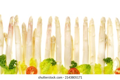 Asparagus Panorama with Spring Lettuce isolated on white Background.