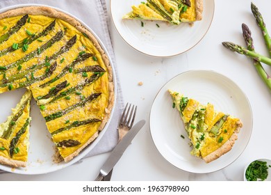 Asparagus tart, vegan quiche homemade pastry, healthy foods. Vegan pie with asparagus on the plate