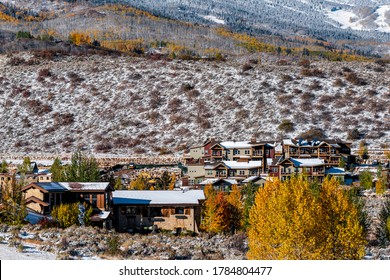 Aspen, Colorado Rocky Mountains With Houses Buildings Covered In Snow After Winter With Yellow Autumn Trees And Cityscape Modern Ski Resort Lodge Townscape