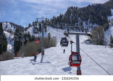 Aspen, Colorado / USA - February 24, 2019:  Skiers And Gondola On Slope At Aspen Mountain Ski Resort